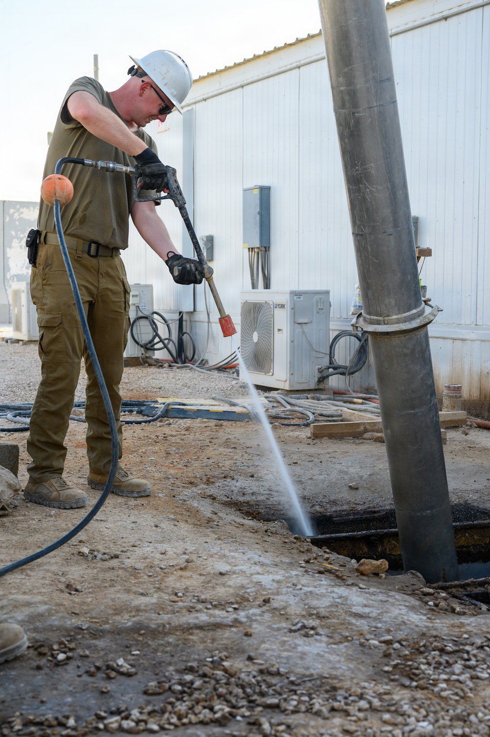 Keeping the mission flowing: WFSM Airmen tackle grease trap maintenance