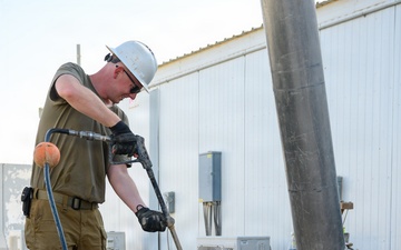 Keeping the mission flowing: WFSM Airmen tackle grease trap maintenance