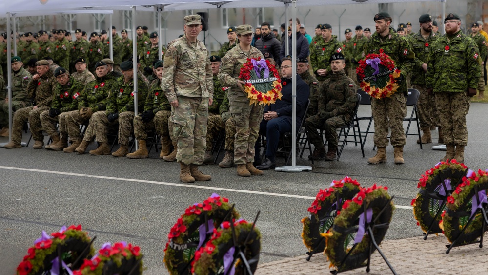 U.S. Army Soldiers prepare to lay a wreath next to other NATO countries’ wreaths