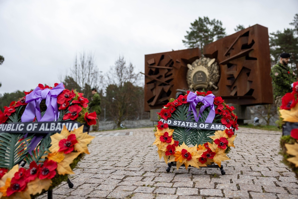 United States of America’s wreath lies next to other NATO countries’ wreaths