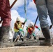 Construction Workers Smooth A Fresh Concrete Pour