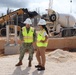The Officer in Charge of Construction Discuss a Pending Concrete Pour