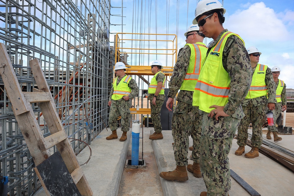Civil Engineering Corps Officers Inspect Rebar During a Site Visit