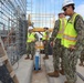 Civil Engineering Corps Officers Inspect Rebar During a Site Visit