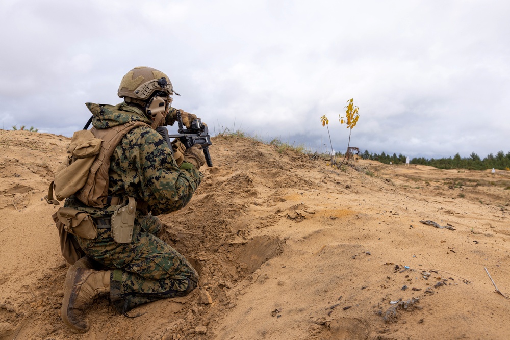 U.S. FASTEUR Marine fires an M320 grenade launcher
