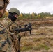 U.S. FASTEUR Marine trains Latvian Mobile Response Team member on firing an M320 grenade launcher