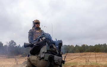 U.S. FASTEUR Marine trains Latvian State Police OMEGA members on firing a MAAWS
