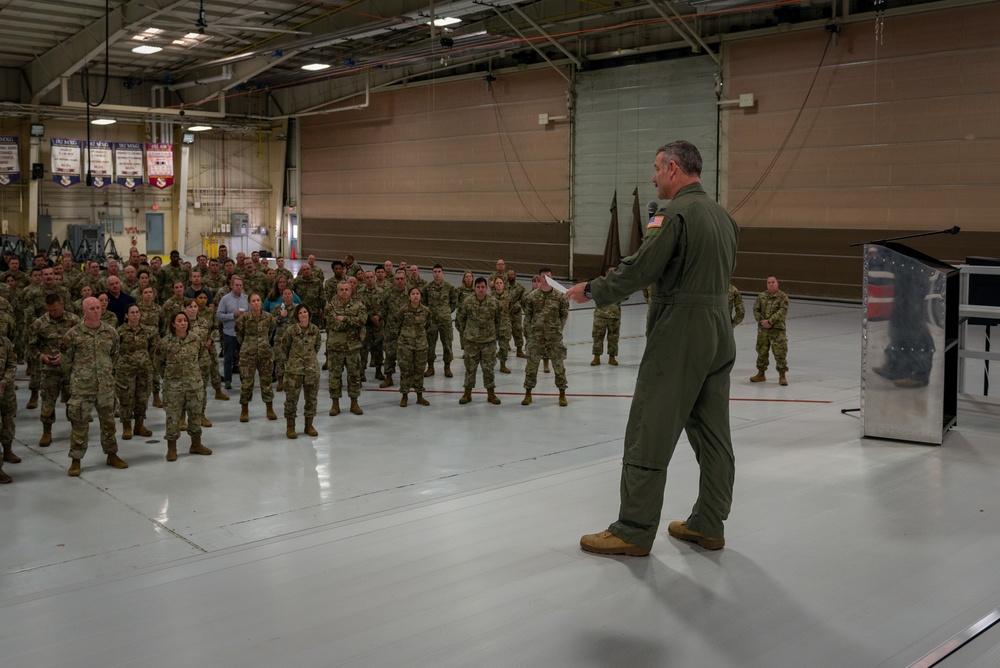 Wing commander Col. Rusty Ballard briefs 182nd Airlift Wing on Combat Readiness Inspection (CRI) results Sept. 10, 2025