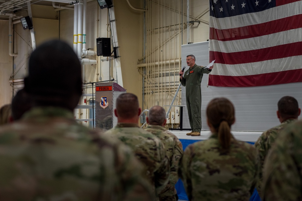 Wing commander Col. Rusty Ballard briefs 182nd Airlift Wing on Combat Readiness Inspection (CRI) results Sept. 10, 2025