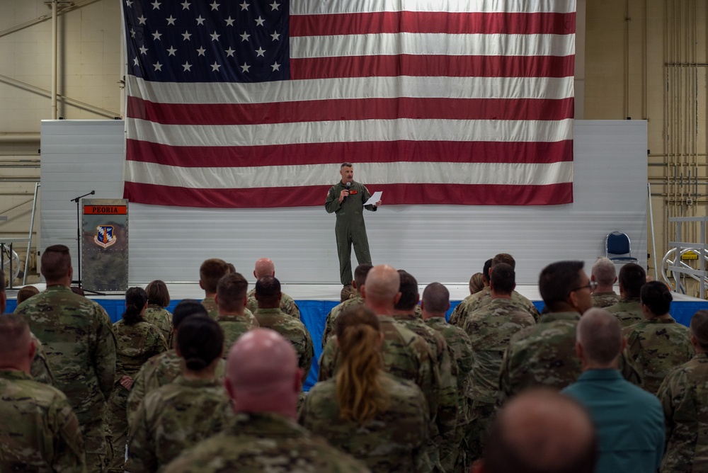 Wing commander Col. Rusty Ballard briefs 182nd Airlift Wing on Combat Readiness Inspection (CRI) results Sept. 10, 2025