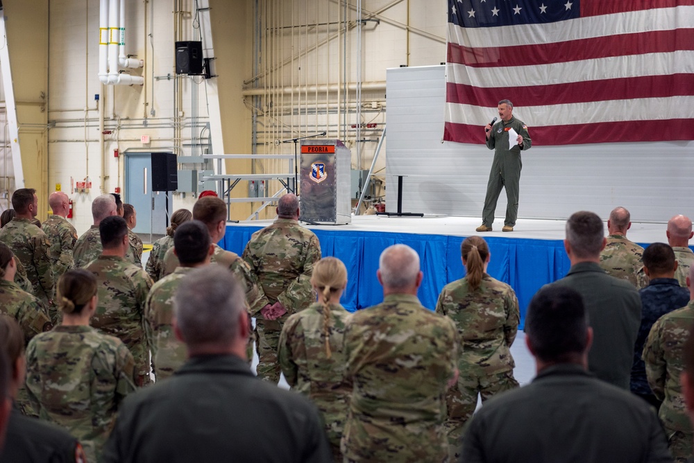 Wing commander Col. Rusty Ballard briefs 182nd Airlift Wing on Combat Readiness Inspection (CRI) results Sept. 10, 2025