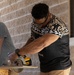 How Doers Get More Done: Marines with CLB-13 make barracks renovations with the help of the Home Depot Foundation volunteers