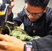VX-1 Sailor conducts maintenance on aircrew equipment