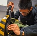 VX-1 Sailor conducts maintenance on aircrew equipment