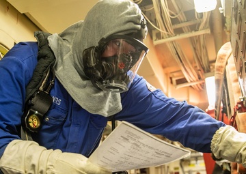 USS Mitscher (DDG 57) Sailor secures power during DC training