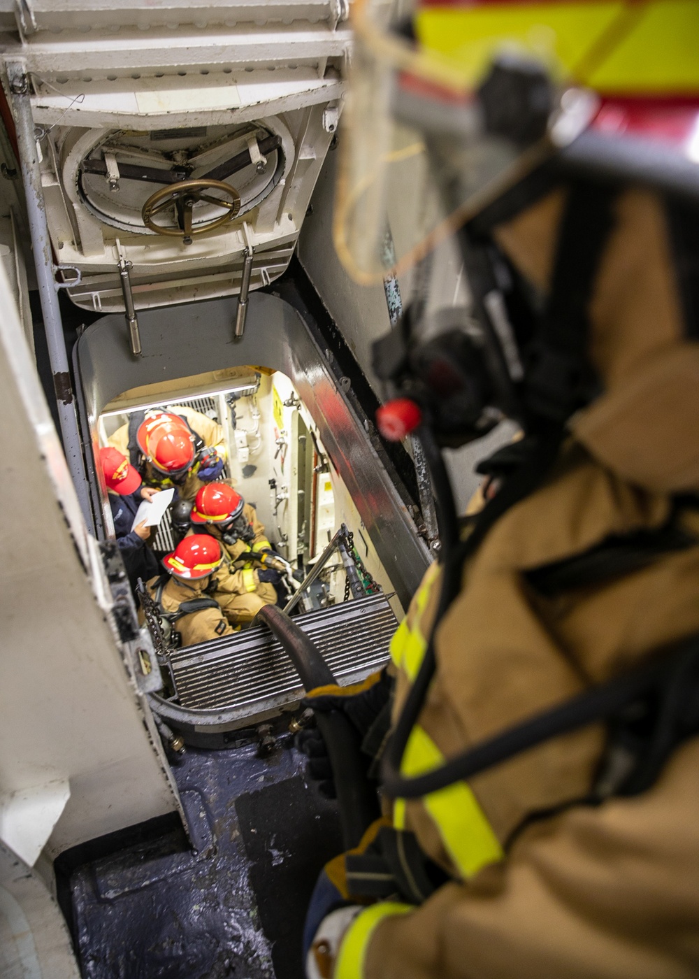 USS Mitscher (DDG 57) Sailors conduct DC training