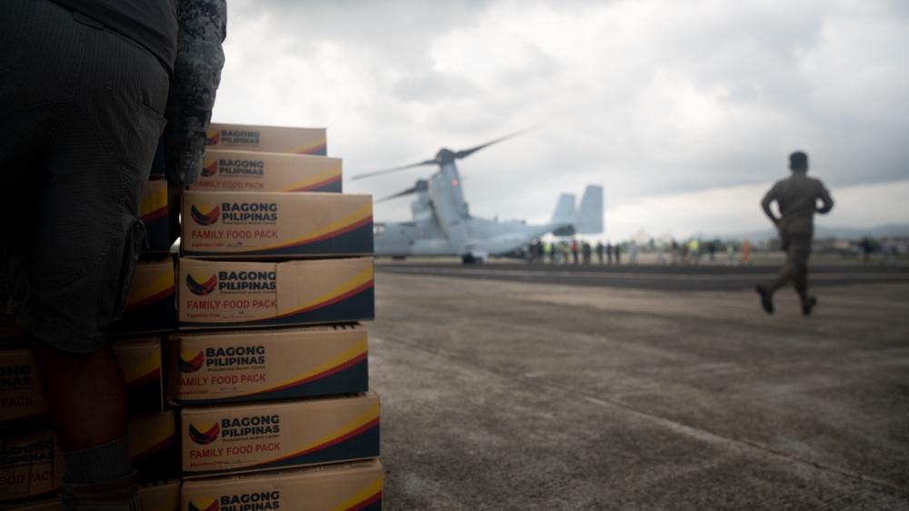 U.S. Marines Support Delivery of Family Food Packs in Philippines During Foreign Disaster Relief Operations