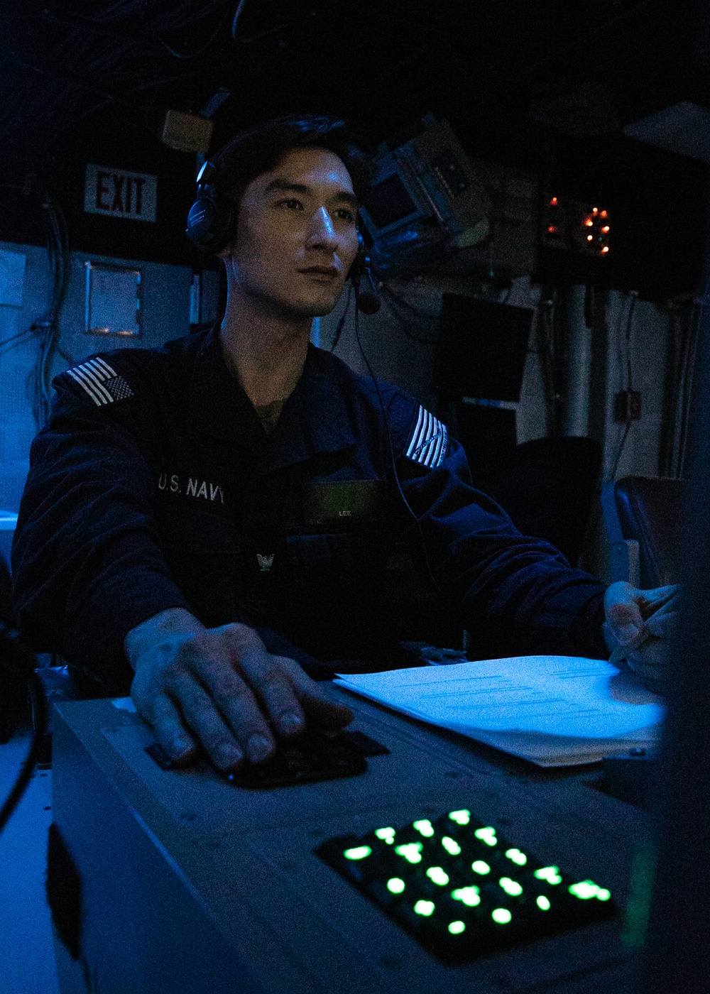 USS Mitscher (DDG 57) Sailor stands watch in sonar control room