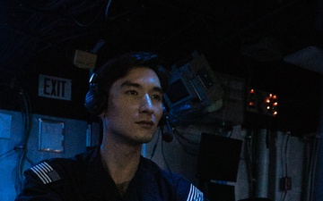 USS Mitscher (DDG 57) Sailor stands watch in sonar control room