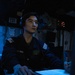 USS Mitscher (DDG 57) Sailor stands watch in sonar control room
