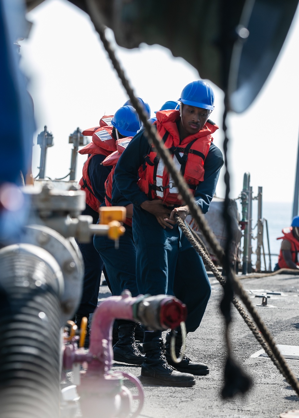 USS Mitscher (DDG 57) Sailors conduct replenishment-at-sea (RAS)
