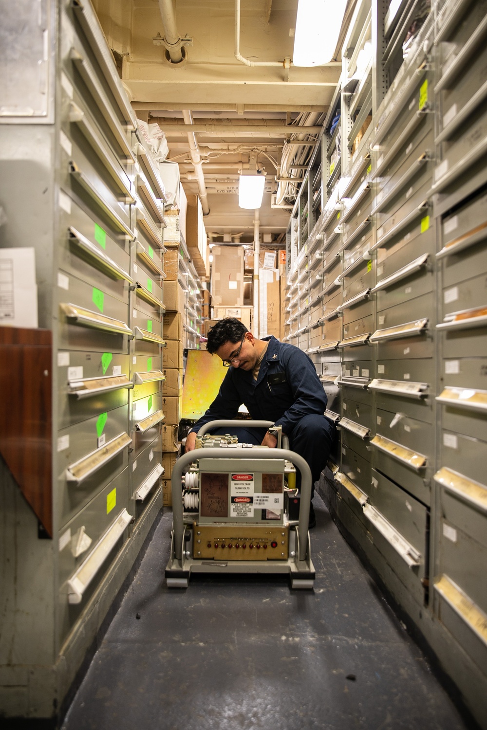 USS Mitscher (DDG 57) takes inventory in logistics storeroom