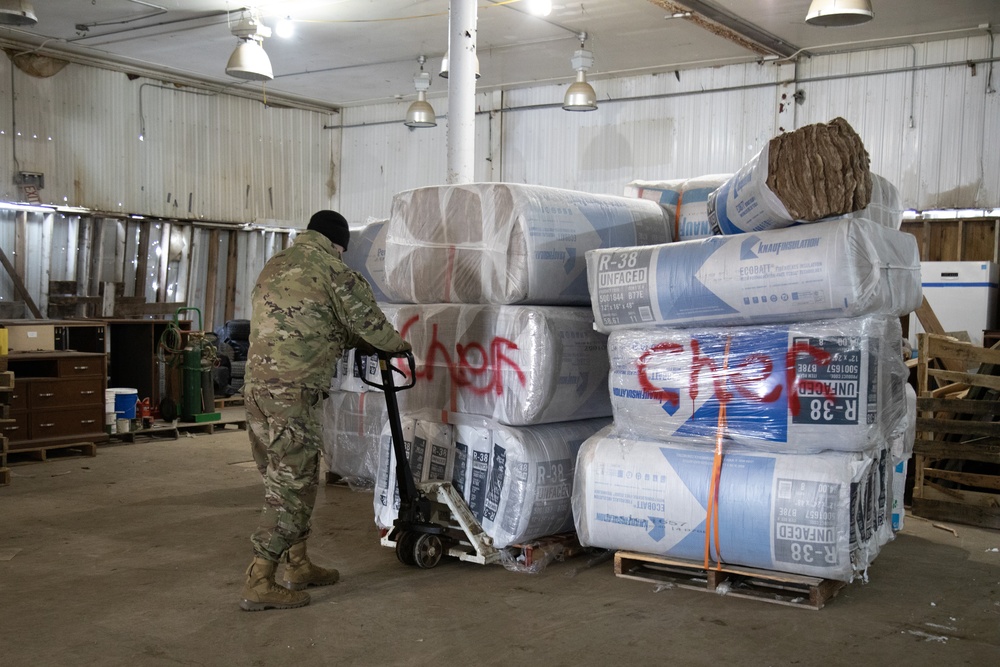 AKOM members distribute building supplies during Operation Halong Response