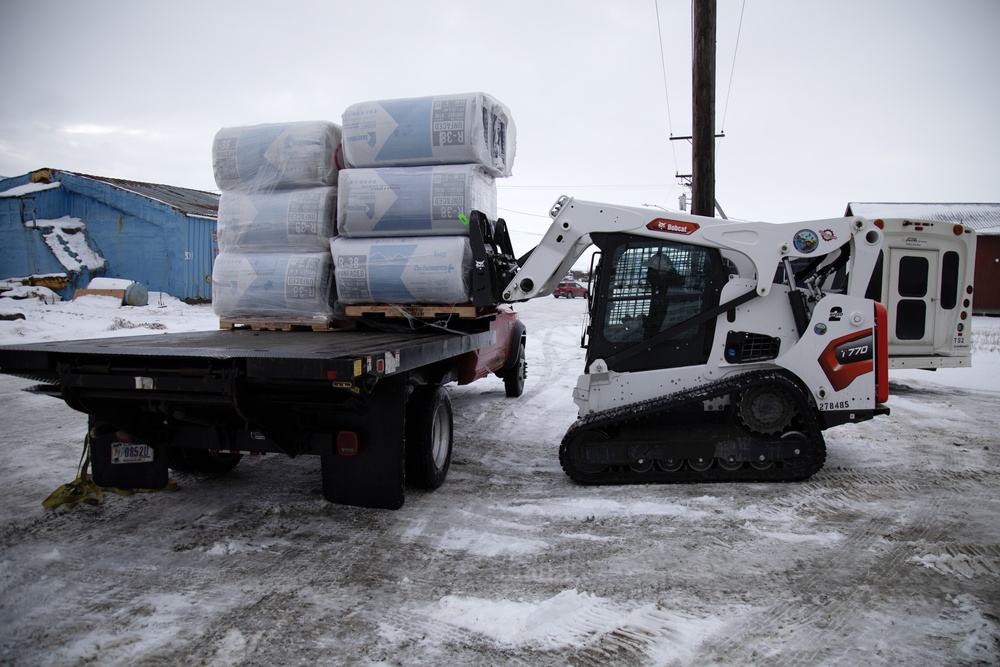 AKOM members distribute building supplies during Operation Halong Response