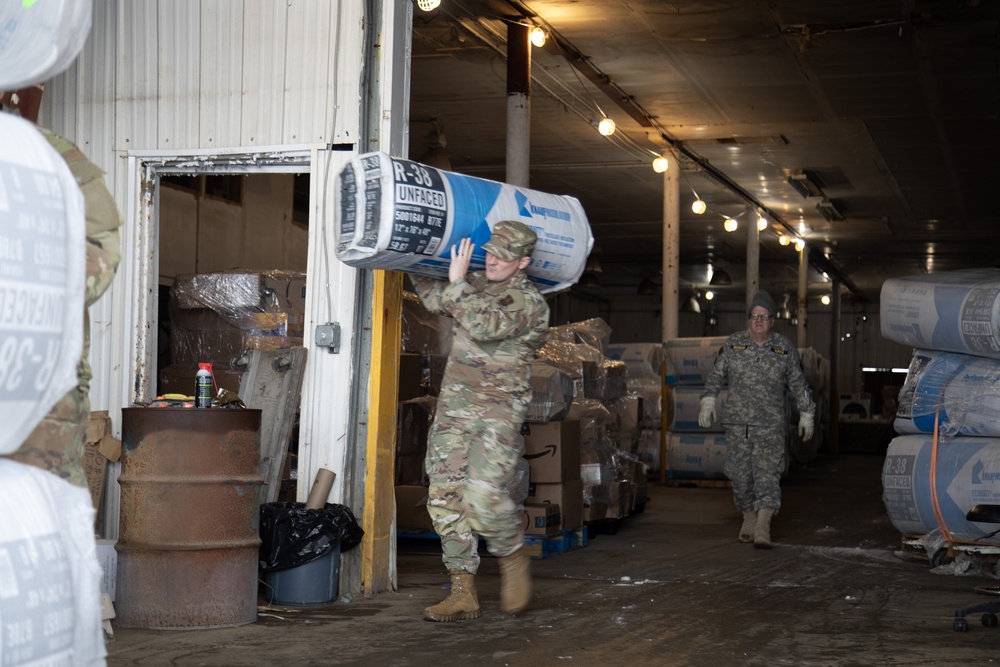 AKOM members distribute building supplies during Operation Halong Response