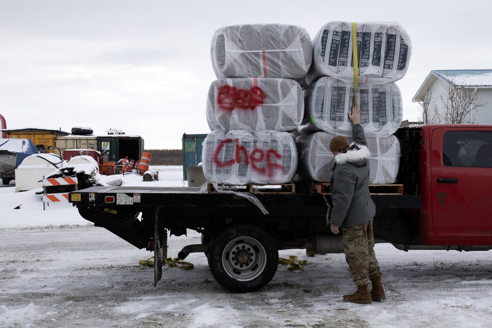AKOM members distribute building supplies during Operation Halong Response