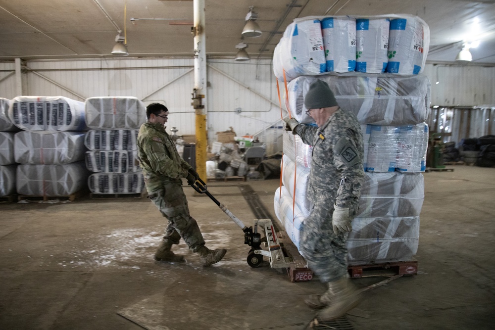 AKOM members distribute building supplies during Operation Halong Response