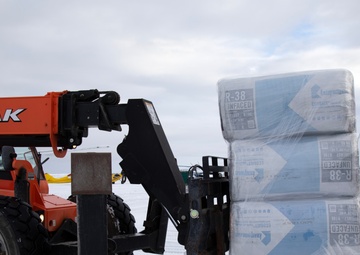 AKOM members distribute building supplies during Operation Halong Response