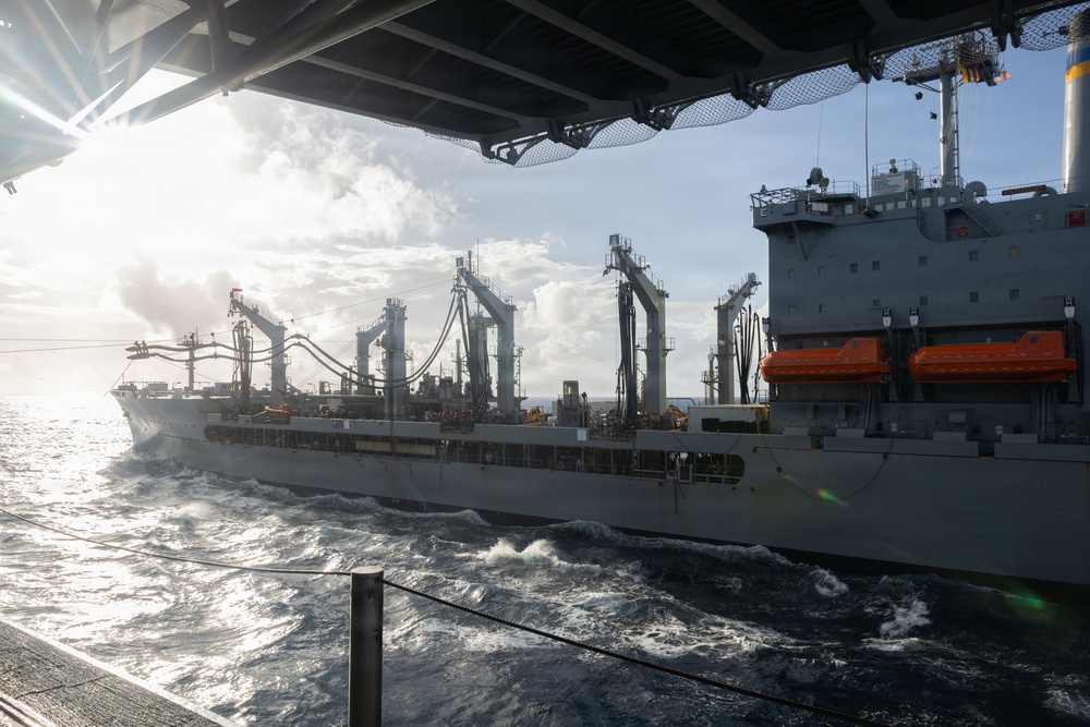 USS Iwo Jima Conducts a Replenishment-At-Sea with USNS Patuxent