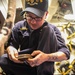 USS Mitscher (DDG 57) Sailor inspects deck socket
