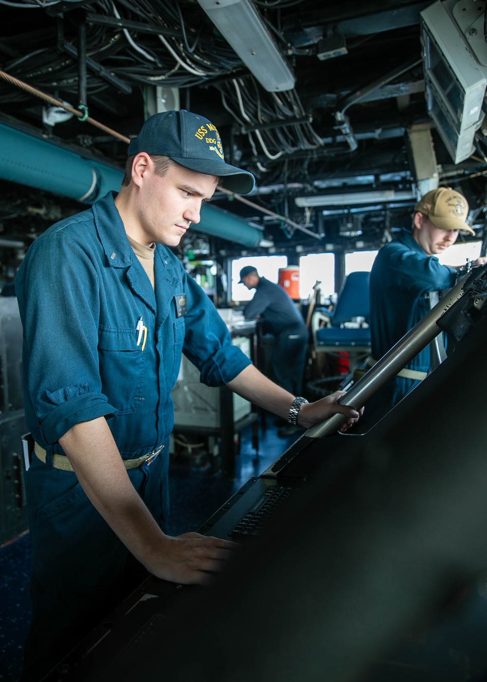 USS Mitscher (DDG 57) junior officer stands bridge watch
