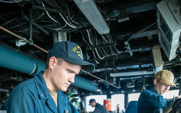 USS Mitscher (DDG 57) junior officer stands bridge watch