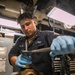 USS Mitscher (DDG 57) Sailor conducts maintenance on valve