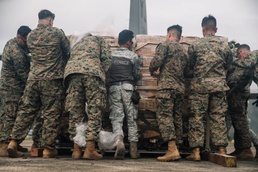 Philippine Service Members, U.S. Marines Offload Family Food Packs at Virac Airport During Foreign Disaster Relief Operations