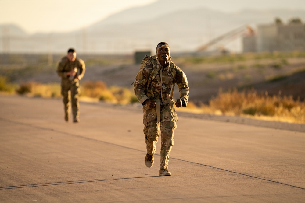 1AD Soldiers compete in 12-mile ruck march during Iron Heroes 2025