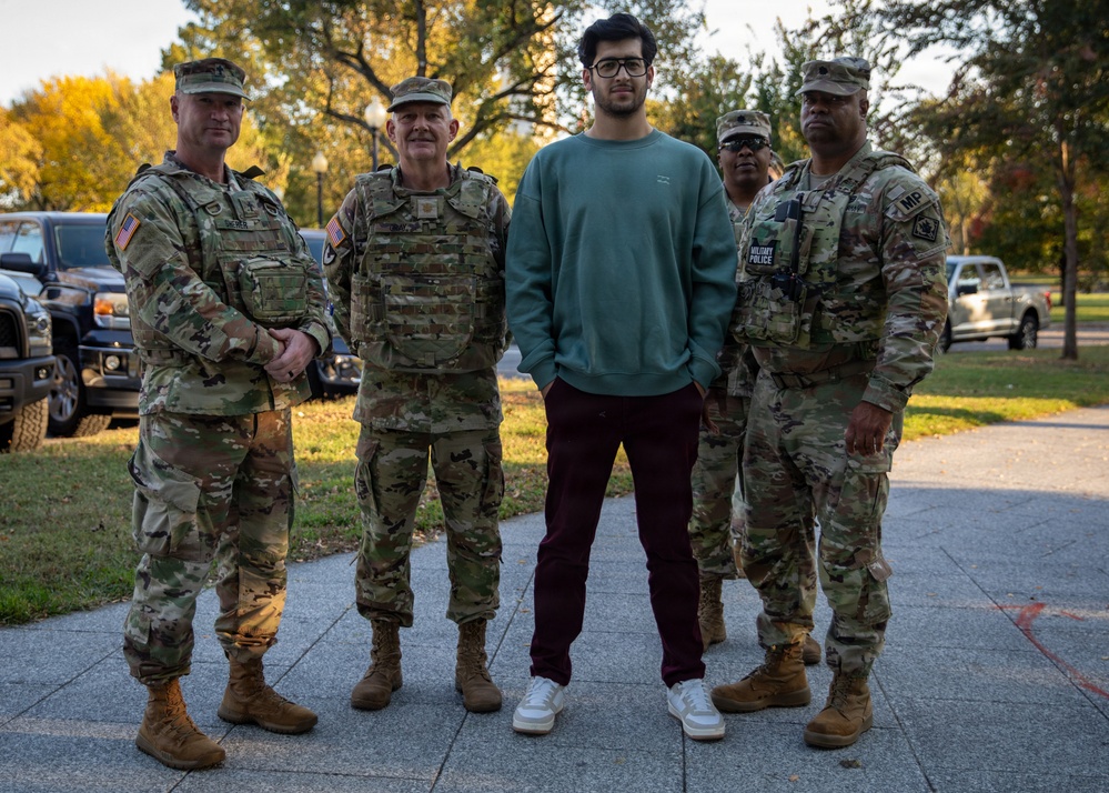 Joint Task Force Magnolia Leadership takes a picture with a member of the public in Washington, D.C.