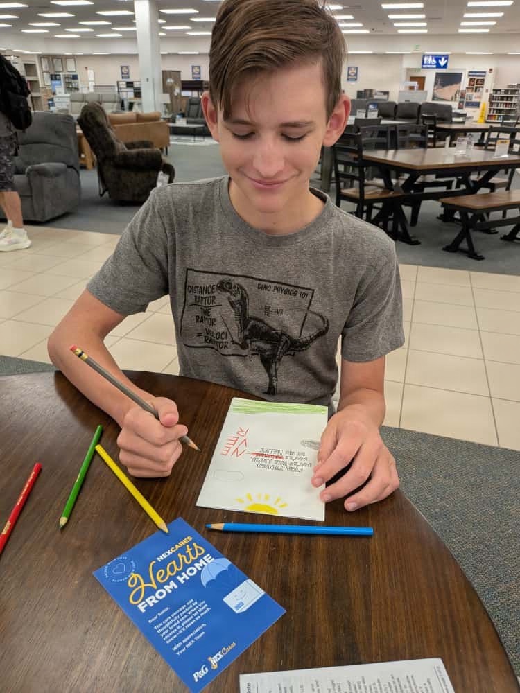 NEX patrons honor deployed loved ones with Hearts from Home care packages