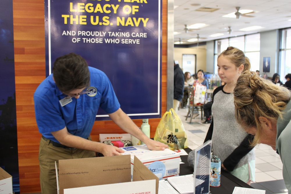 NEX patrons honor deployed loved ones with Hearts from Home care packages