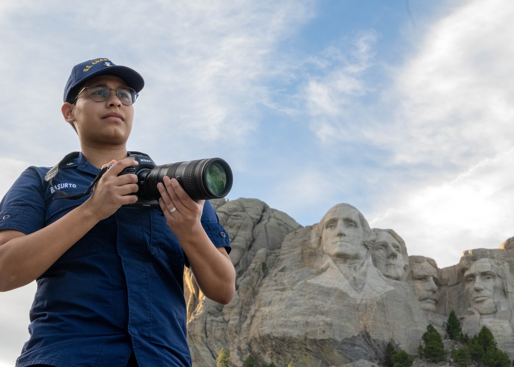 U.S. Coast Guard assets fly over Mount Rushmore National Memorial