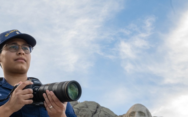 U.S. Coast Guard assets fly over Mount Rushmore National Memorial