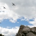U.S. Coast Guard assets fly over Mount Rushmore National Memorial