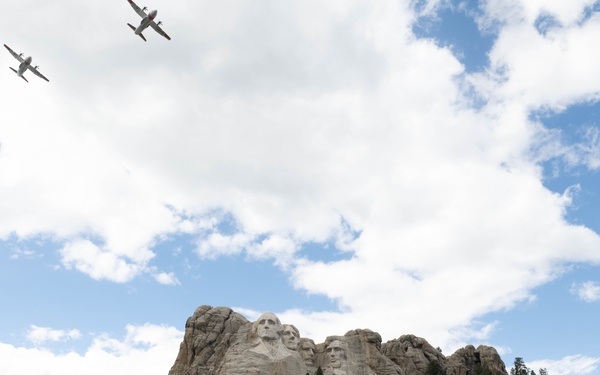 U.S. Coast Guard assets fly over Mount Rushmore National Memorial