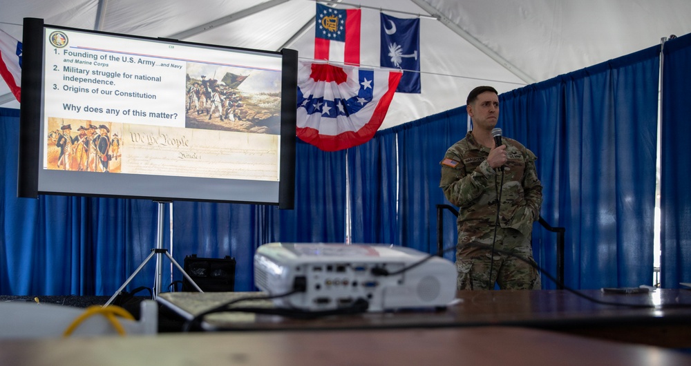 Service Member and civilians watch documentary on Revolutionary War