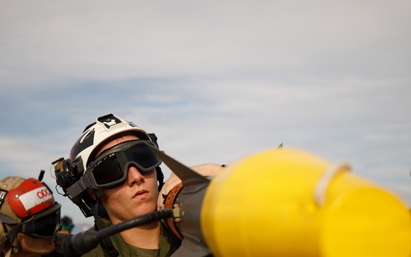 VMFA-232 and MALS-12 off-load live ordnance at MCAS Iwakuni