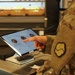 Soldier picks meal on terminal for the autonomous kitchen