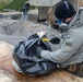 U.S. Marine explosive ordnance disposal technicians execute an experimental demolition range
